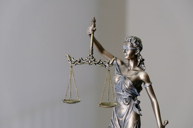 Justice figurine holding a scale
